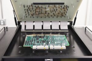 1 ict bed of nails fixture testing a pcb.