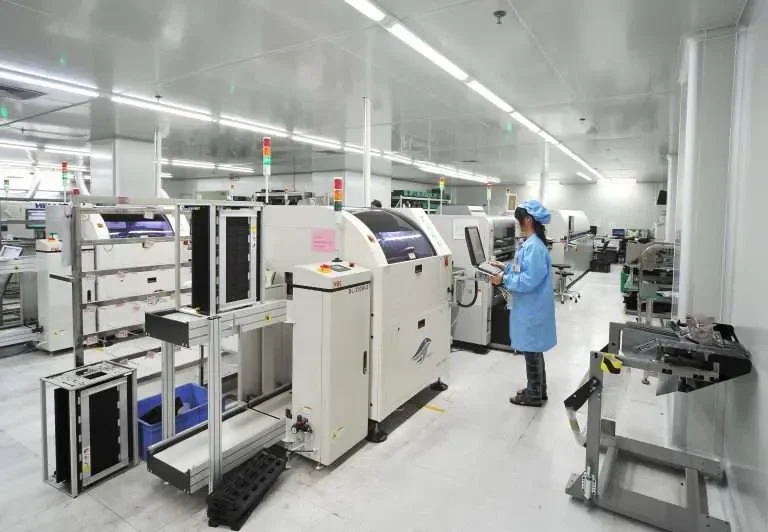 SMT factory audit image showing automated PCB assembly line in China