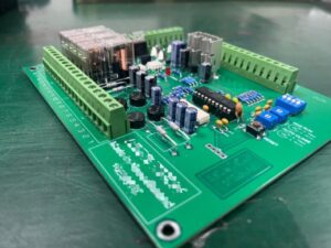 Power regulation controller PCBA with terminal blocks and through-hole components